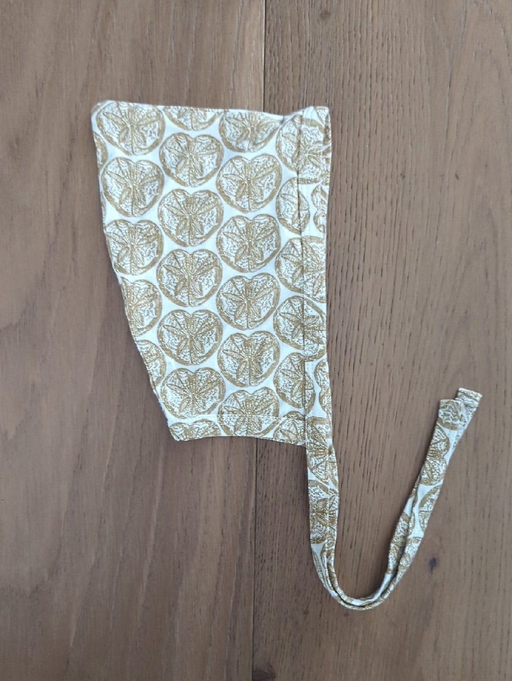 Kate Quinn | Bonnet in White & Tan With Oranges Pattern